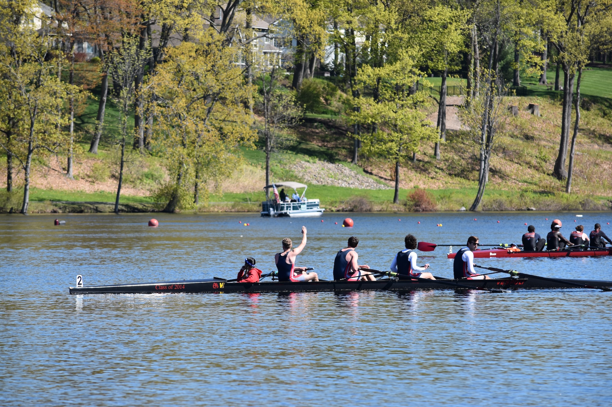 Men's Varsity 4 on the water after a race.