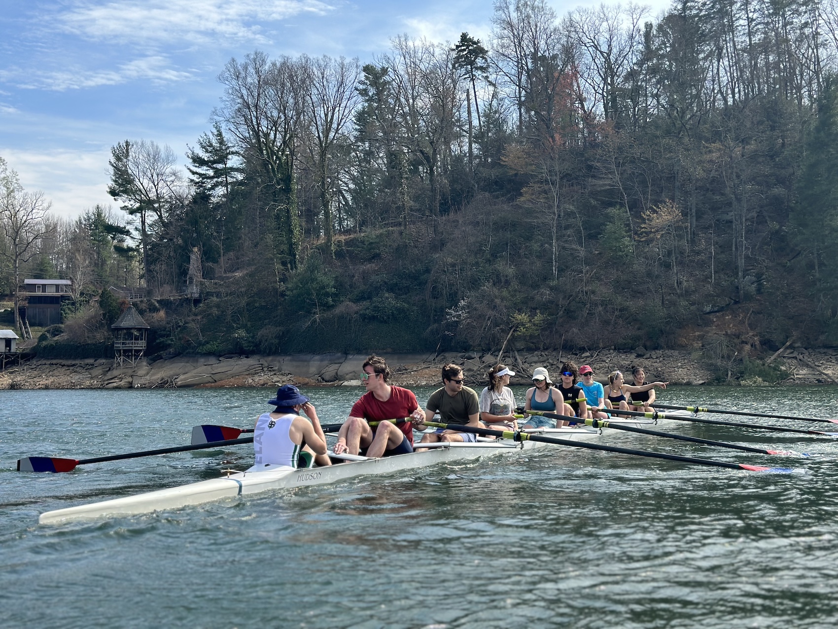 Co-ed Varsity 8 boat on the water at Spring Break.